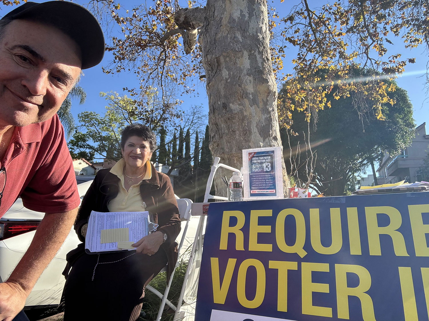 man wearing cap and a woman sitting